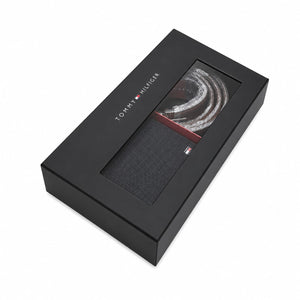 Top-down studio product view of the closed Tommy Hilfiger premium presentation gift box featuring a transparent window showcasing the smooth wallet and reversible belt buckle