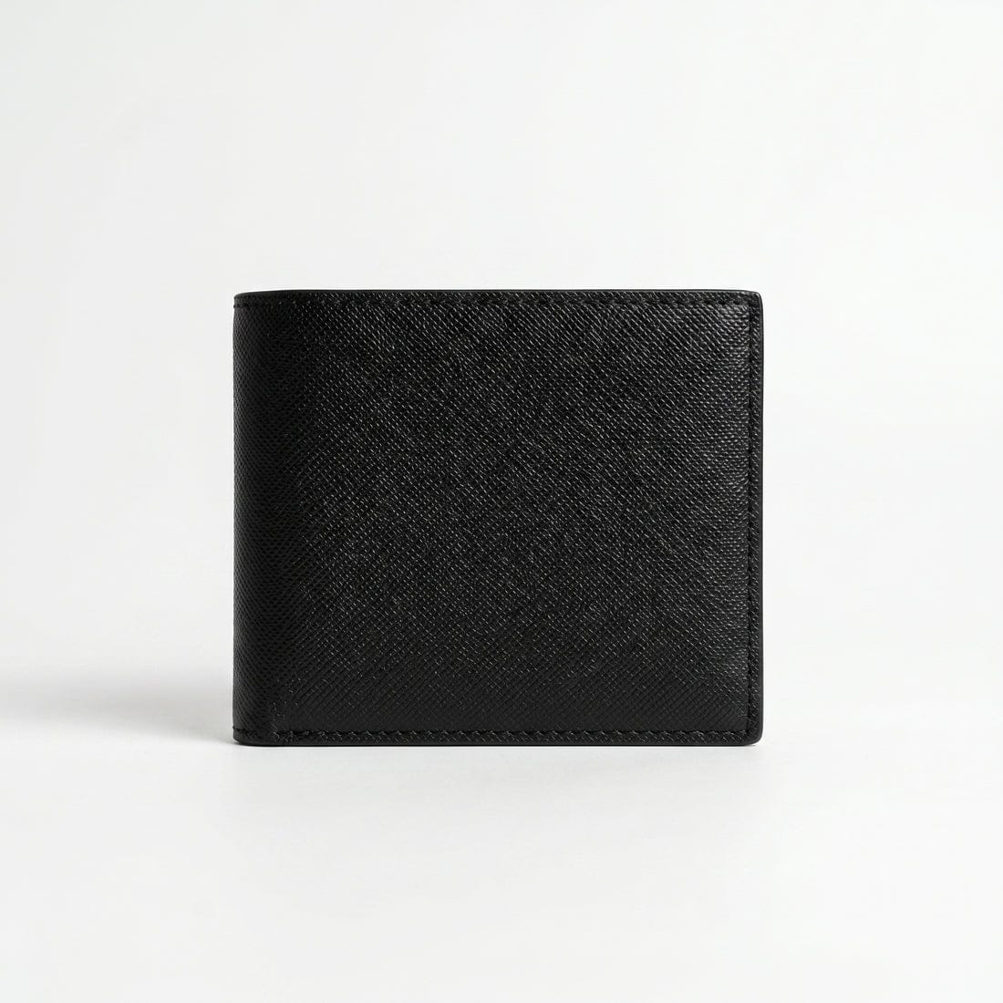 Live back view smartphone product photography of the Tommy Hilfiger smooth black leather wallet showing clean minimalist stitched edges