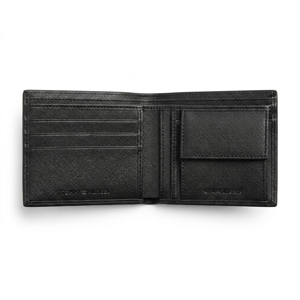 Live high-angle view of the Tommy Hilfiger smooth leather wallet currency compartment displaying the navy fabric lining and original tracking barcode label