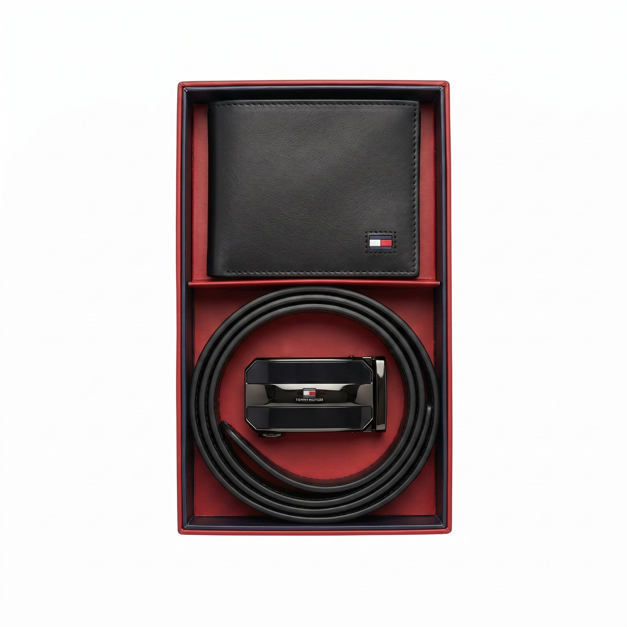 Top-down high-resolution studio presentation of the open Tommy Hilfiger mirror original textured bifold wallet and black leather belt gift set resting perfectly inside its custom tray lining