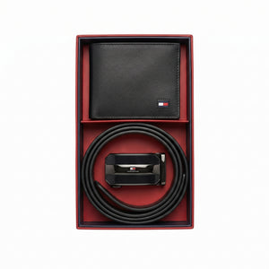 Top-down high-resolution studio presentation of the open Tommy Hilfiger mirror original textured bifold wallet and black leather belt gift set resting perfectly inside its custom tray lining