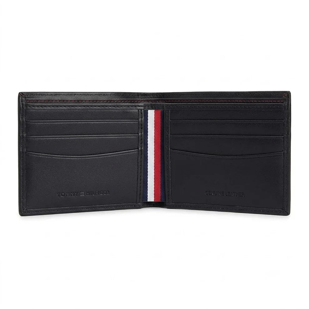 Live angled view of the Tommy Hilfiger black leather bifold wallet interior highlighting the premium stitching and deep navy paper currency slot