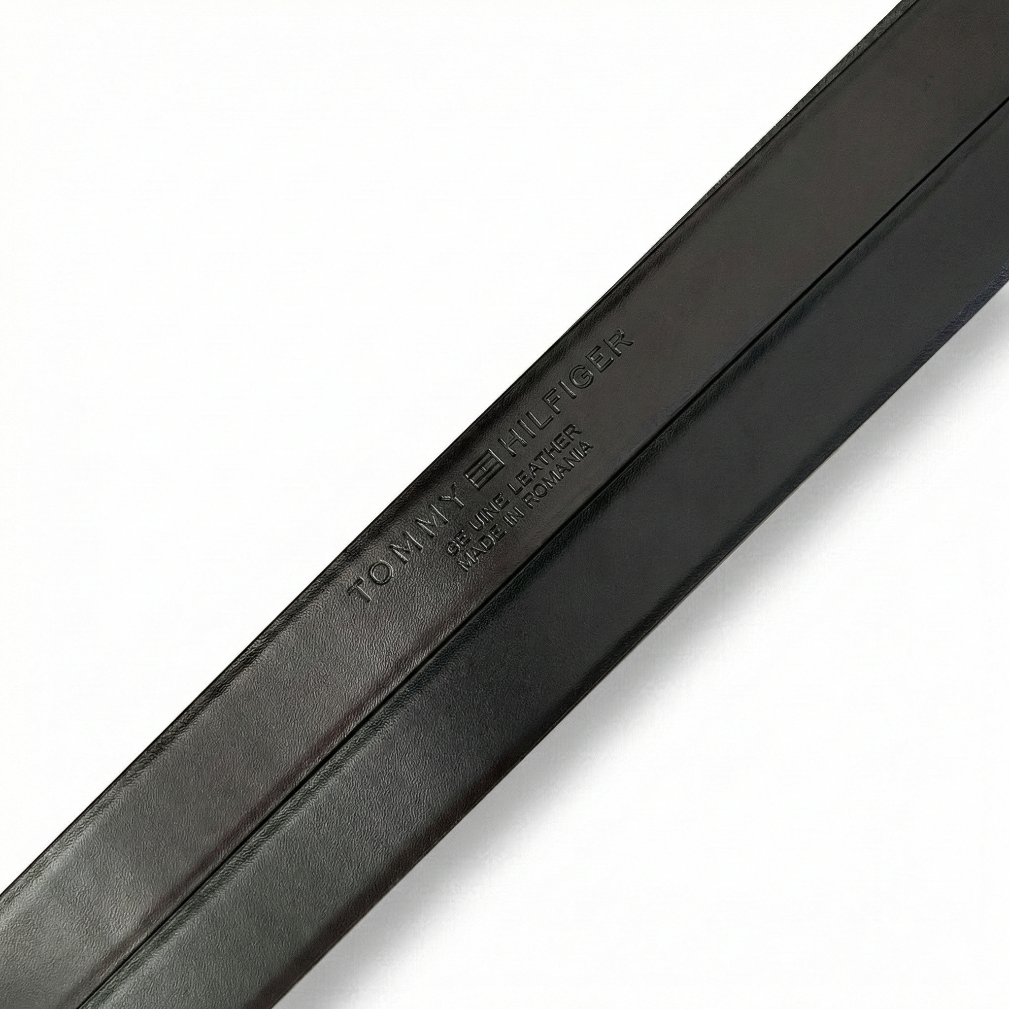 Close up of Engraved Tommy Hilfiger Logo on Genuine Leather Belt Strap