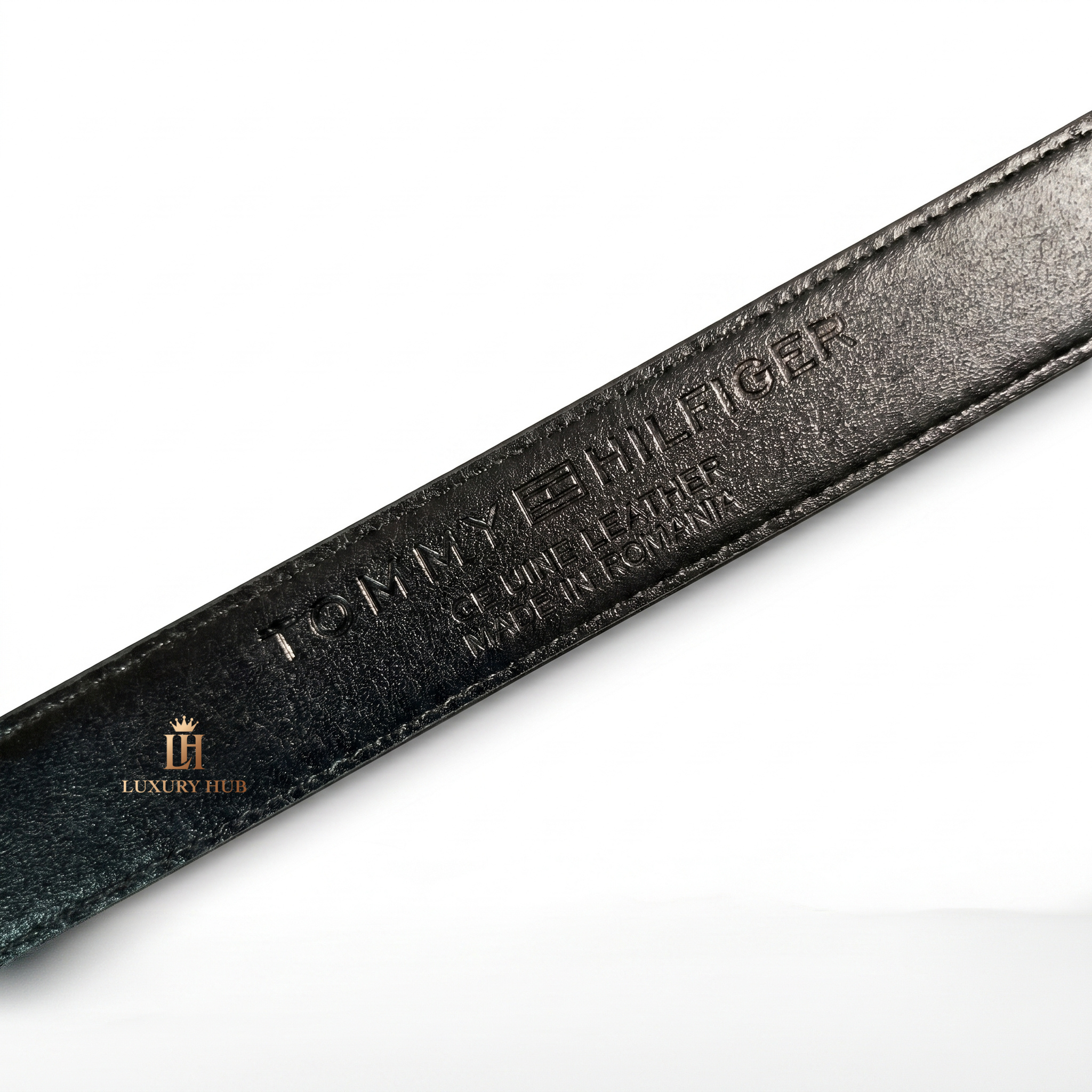 Detailed close-up of the Tommy Hilfiger polished silver pin buckle showing the iconic color flag logo