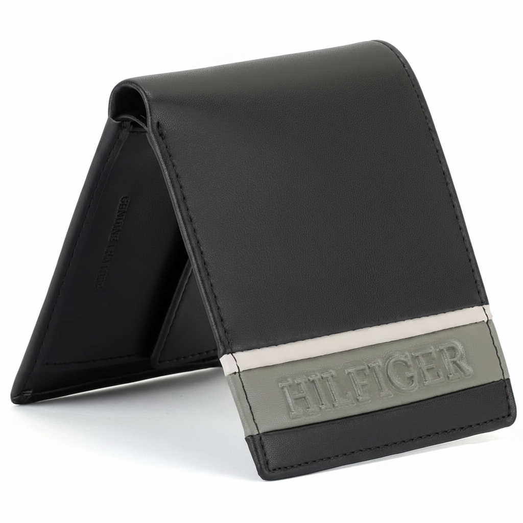 Side view of a standing Tommy Hilfiger tan genuine leather bifold wallet showcasing its sleek profile and contrasting color design