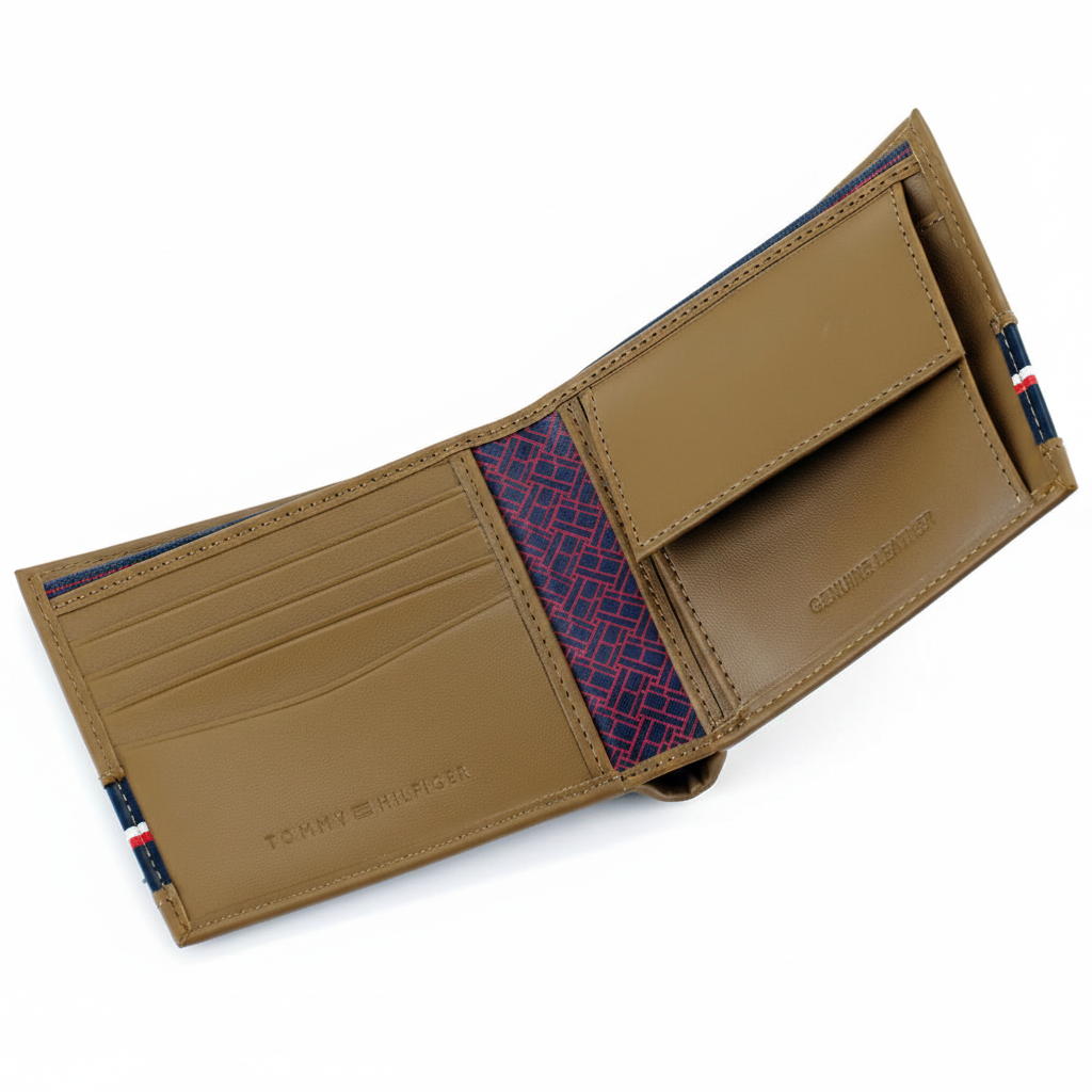 Detailed interior of the Tommy Hilfiger tan leather wallet showing organized card slots, a secure buttoned coin pocket, and a stylish patterned fabric lining