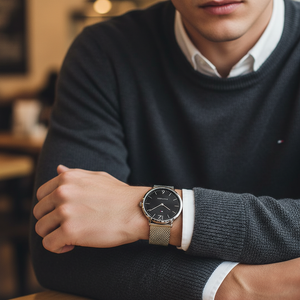 Man wearing elegant Tommy Hilfiger Ultra Slim 1710355 watch with silver mesh bracelet