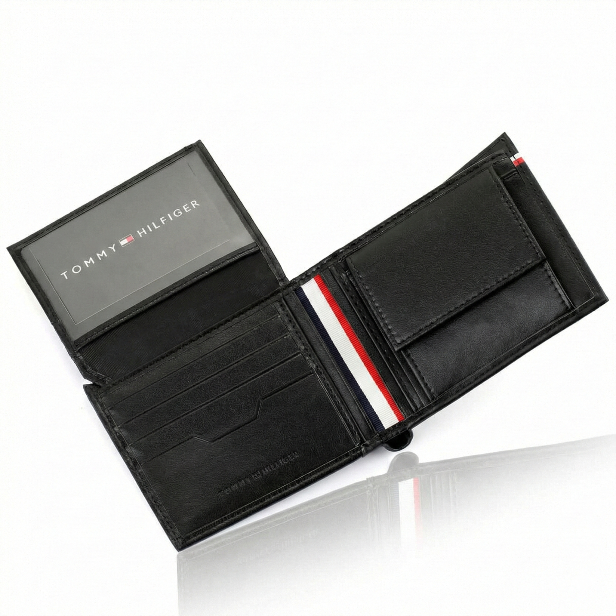 Interior view of Tommy Hilfiger Black Wallet showing coin pocket, card slots, and signature tricolor spine