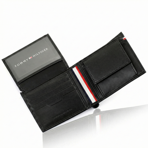 Interior view of Tommy Hilfiger Black Wallet showing coin pocket, card slots, and signature tricolor spine