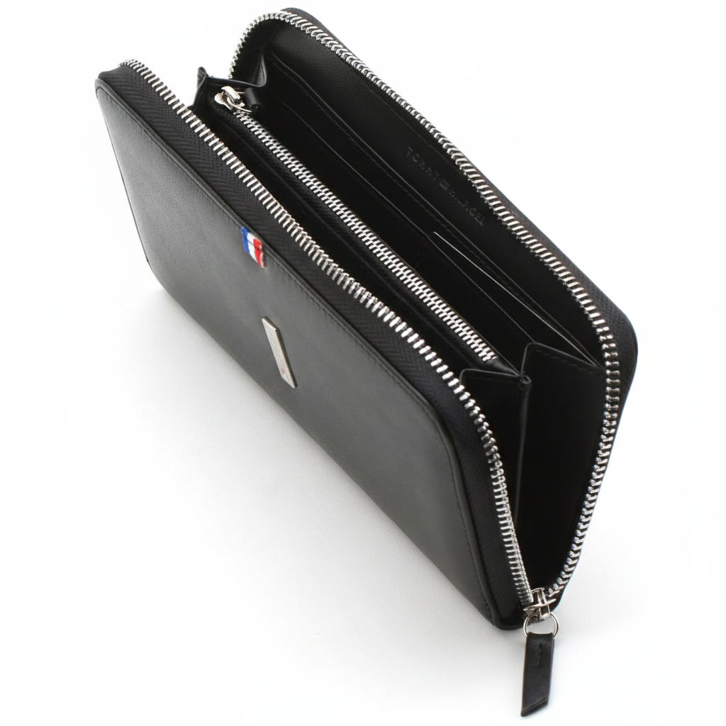 Side profile view of the Tommy Hilfiger long wallet showing sleek design and branded metal zipper puller.