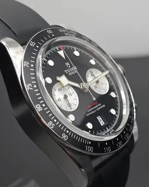 Tudor Black Bay Chrono men's chronograph watch, 41mm stainless steel case, black dial, black rubber strap – angle view