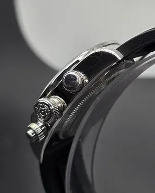 Tudor Black Bay Chrono men's chronograph watch, 41mm stainless steel case, black dial, black rubber strap – crown side close-up