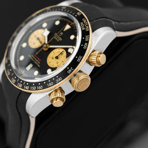 Tudor Black Bay Chrono S&G men's chronograph watch, 41mm steel and yellow gold case, champagne chronograph counters, black rubber strap – dial close-up
