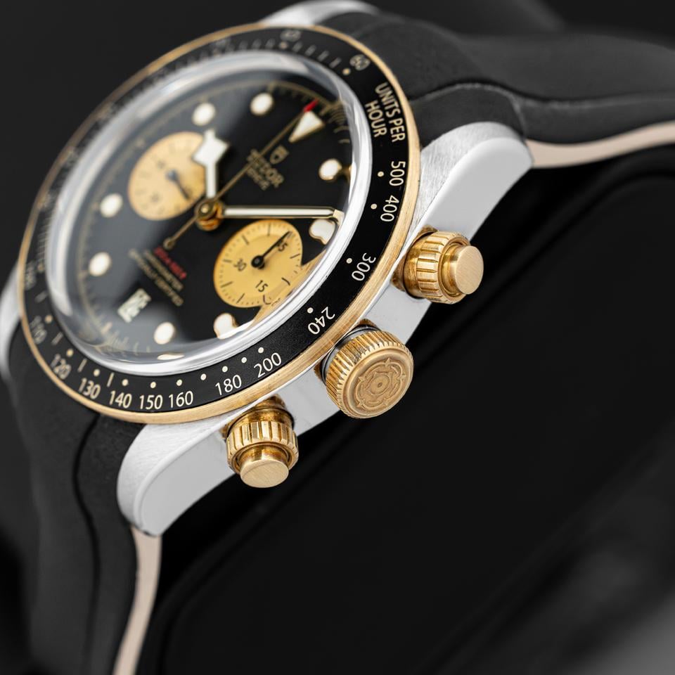 Tudor Black Bay Chrono S&G men's chronograph watch, 41mm steel and yellow gold case, champagne chronograph counters, black rubber strap – dial close-up