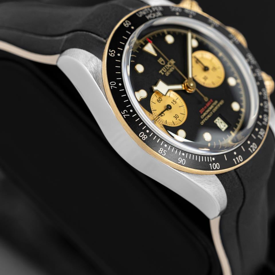 Tudor Black Bay Chrono S&G men's chronograph watch, 41mm steel and yellow gold case, champagne chronograph counters, black rubber strap – side angle close-up