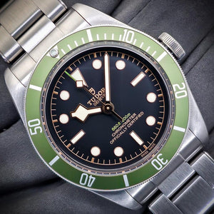 Tudor Black Bay Harrods Edition M79230G-0001 men's automatic dive watch, 41mm stainless steel case, black dial, green bezel, steel bracelet – front close-up