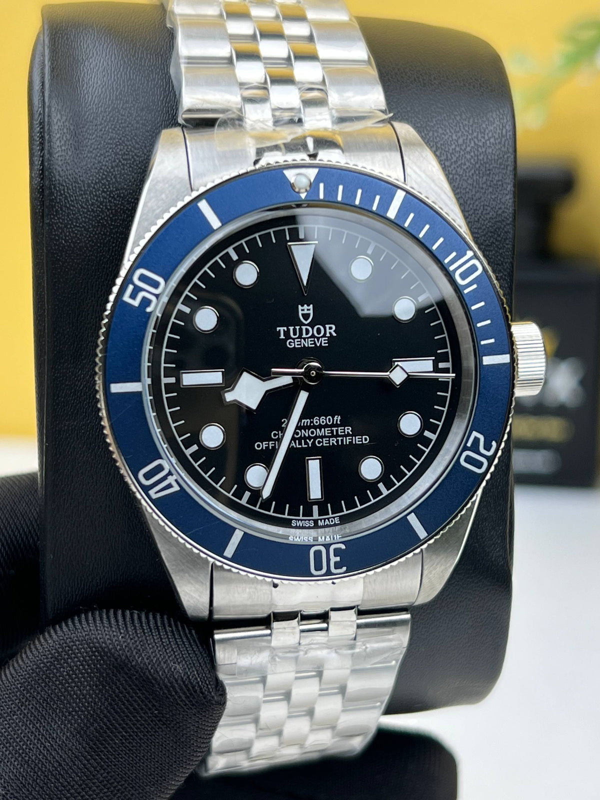 Tudor Black Bay M79230B-0008 men's automatic dive watch, 41mm stainless steel case, black dial, blue bezel, steel bracelet – front view on display