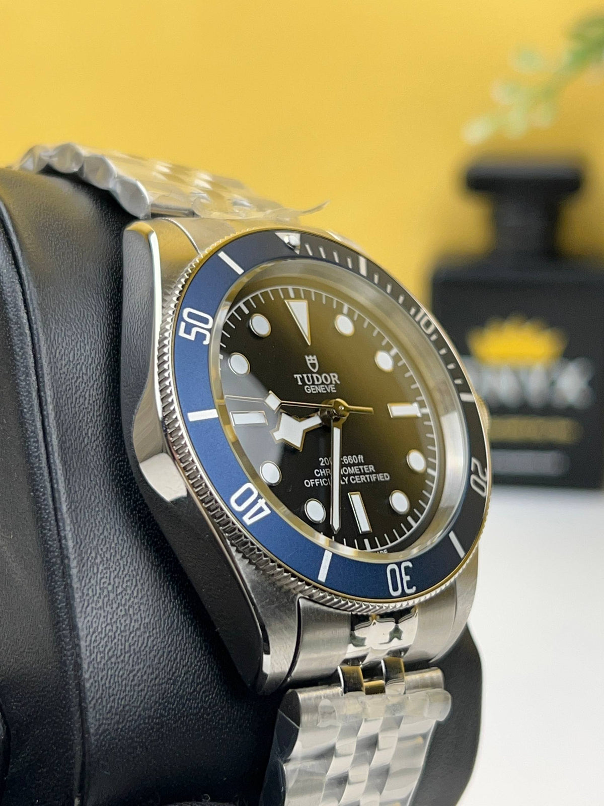 Tudor Black Bay M79230B-0008 men's automatic dive watch, 41mm stainless steel case, black dial, blue bezel, steel bracelet – left angle view
