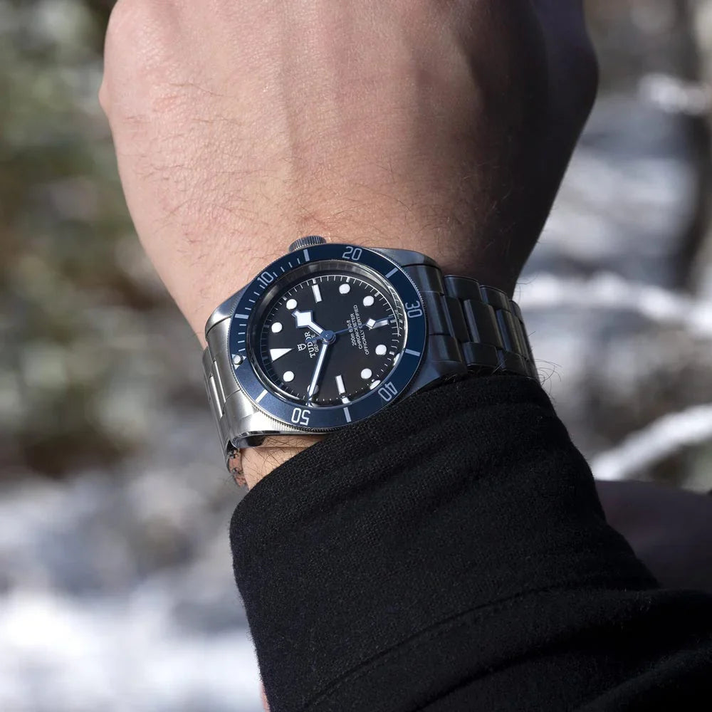 Tudor Black Bay M79230B-0008 men's automatic dive watch, 41mm stainless steel case, black dial, blue bezel, steel bracelet – on wrist view