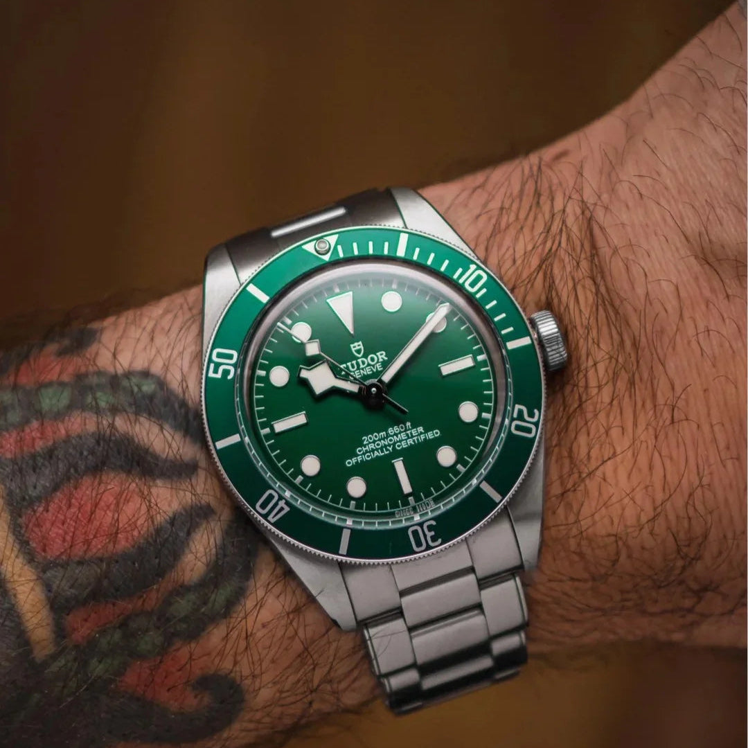 Tudor Black Bay men's automatic dive watch, 41mm stainless steel case, green dial, green bezel, steel bracelet – on wrist view