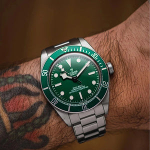 Tudor Black Bay men's automatic dive watch, 41mm stainless steel case, green dial, green bezel, steel bracelet – on wrist view