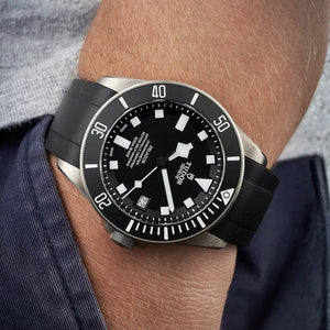 Tudor Pelagos men's automatic dive watch, 42mm titanium case, black dial, black ceramic bezel, black rubber strap – on wrist view