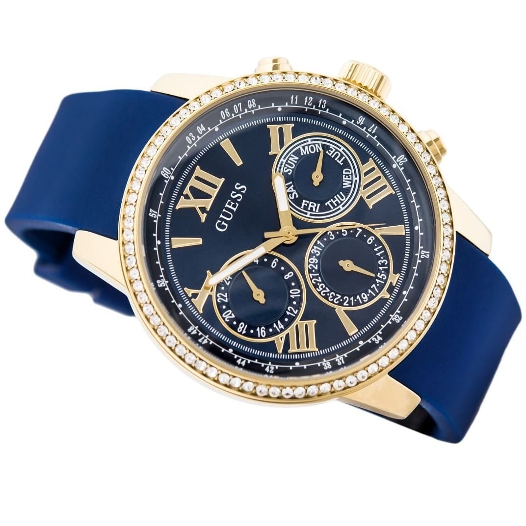 Detailed view of polished rose gold-tone crown on Guess Sunrise W0616L2 women's multi-function watch with textured grip