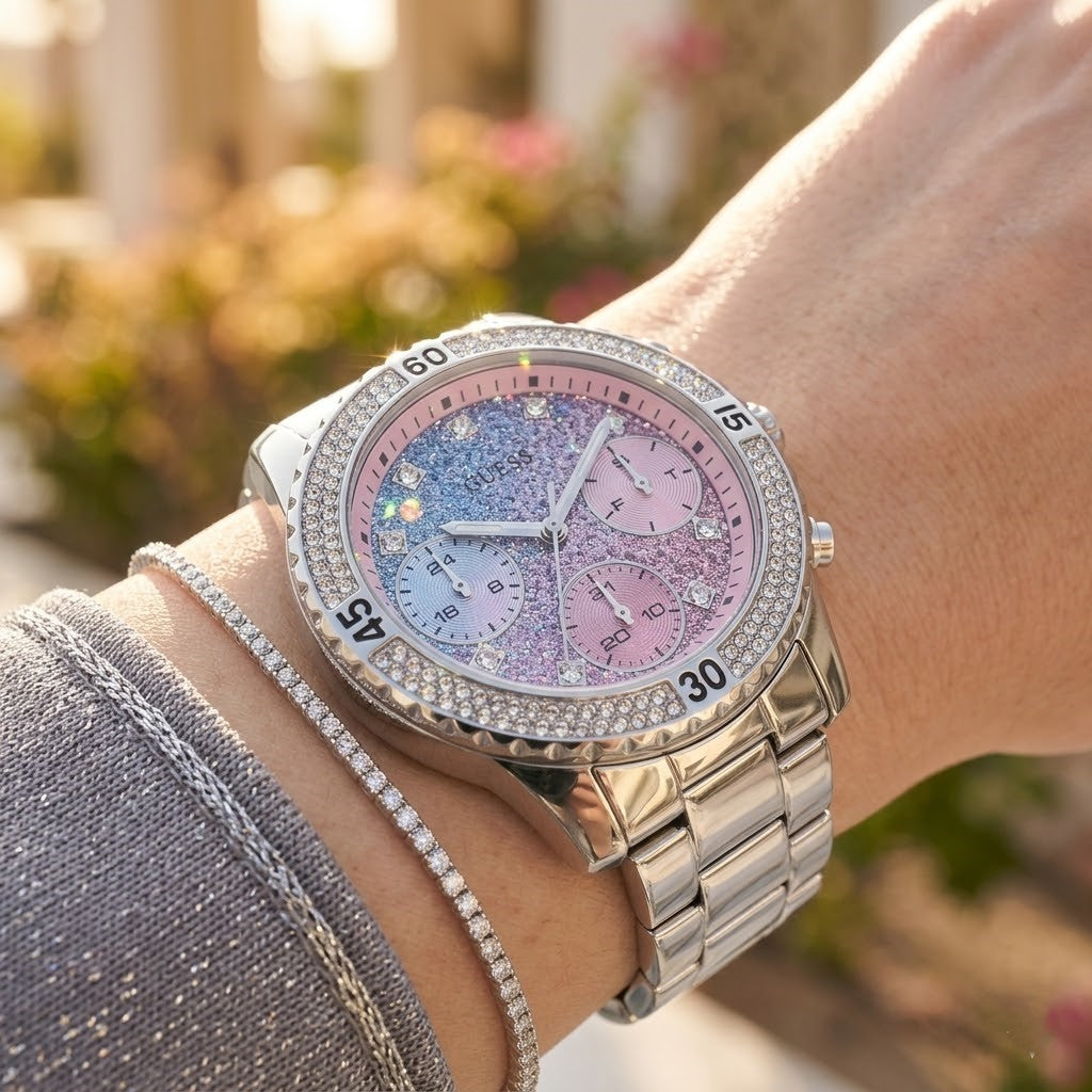 Close up shot of Guess W0774L1 on wrist showing glitter ombre dial and crystal details