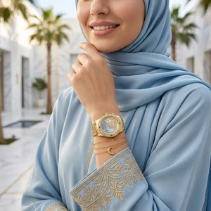 Lifestyle photo of Guess W0774L2 showing the watch on a woman's wrist with accessories