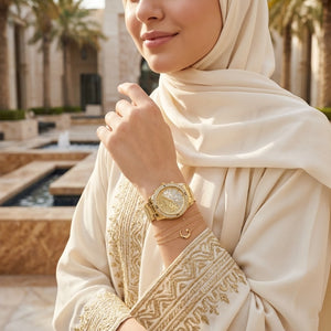 Lifestyle photo of Guess W0774L5 showing the watch on a woman's wrist with accessories
