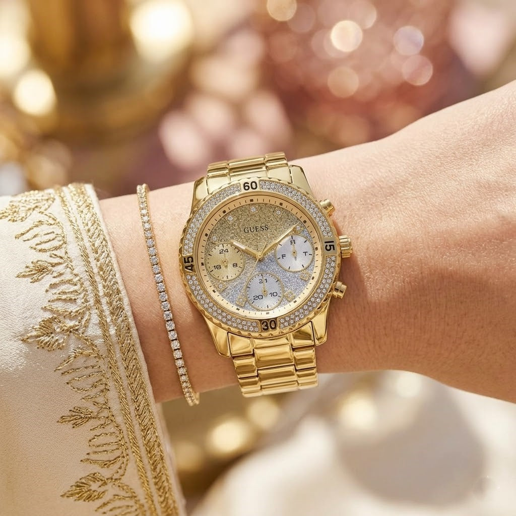 Close up shot of Guess W0774L5 on wrist showing glitter ombre dial and crystal details