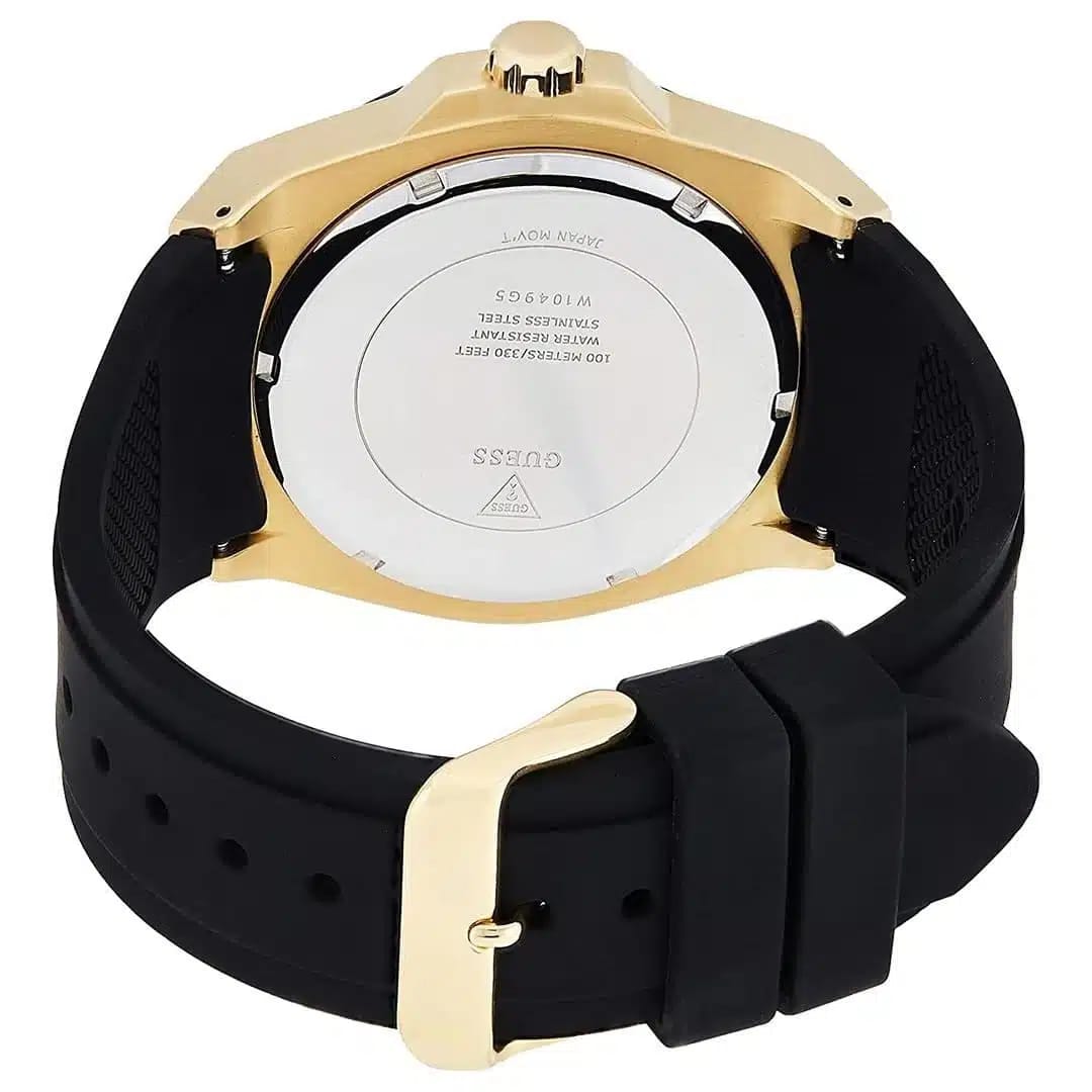 Caseback of Guess Legacy W1049G5 men's quartz battery watch showing technical specs 100m water resistance and rubber strap