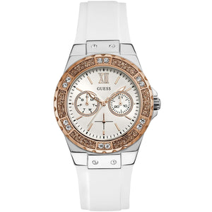 Guess watch with white strap and rose gold case on a white background