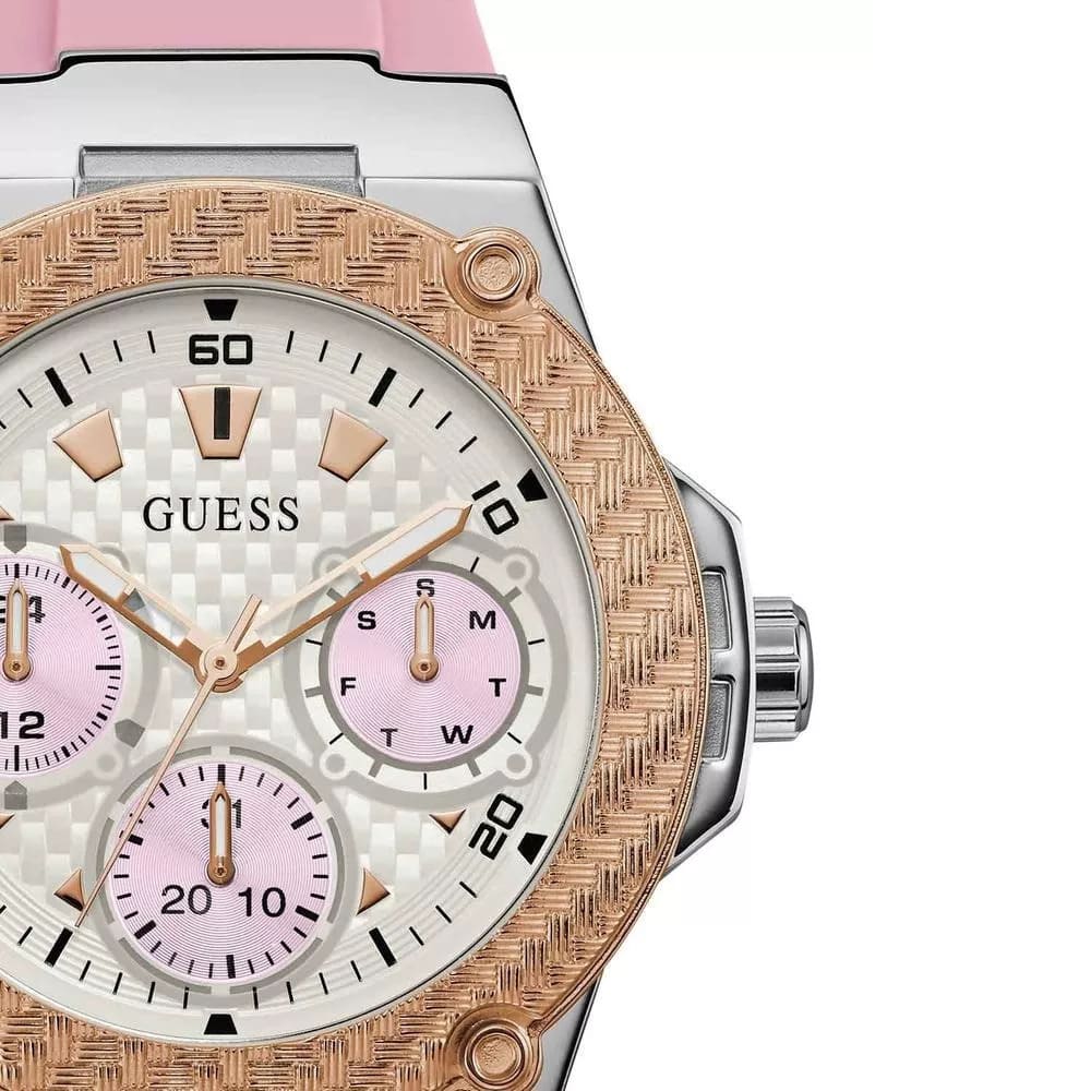 Guess watch with pink and rose gold accents on a white background