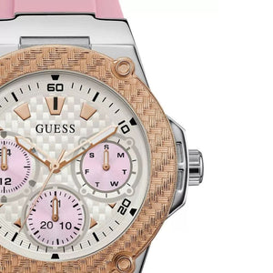 Guess watch with pink and rose gold accents on a white background
