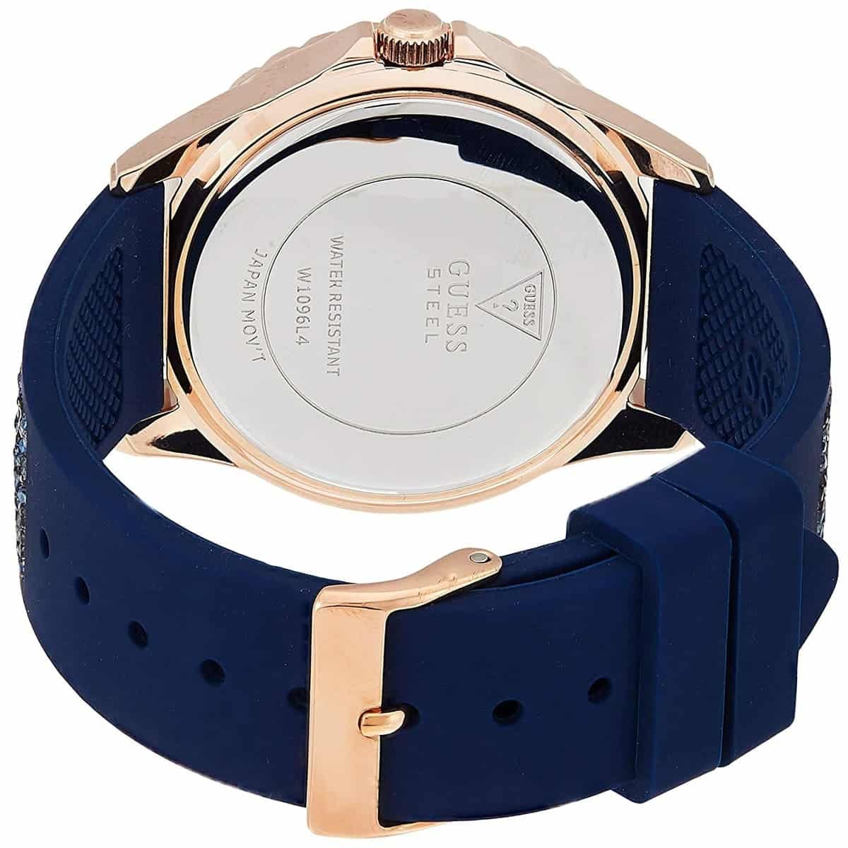 Caseback of Guess Swirl W1096L4 women's quartz battery watch showing technical specs 30m water resistance and stainless steel material