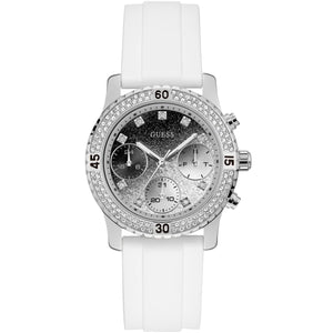 Guess Confetti Multi-Function W1098L1 women's watch with cushion-shaped silver-tone case, dynamic bezel embellished with crystals and screw details, deep silver-white dial with luminous yellow silver hands and indices, and integrated flexible pure white silicone rubber strap main view