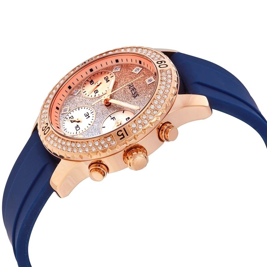 Right angled view of Guess Confetti W1098L6 women's multi-function watch highlighting polished gold finish and cushion case details