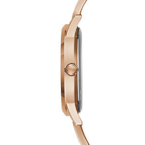 Side profile of Guess W1145L4 women's quartz battery watch showing 8mm thickness and polished rose gold finish