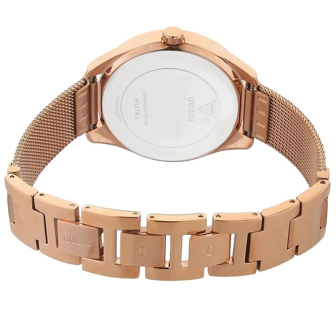 Caseback of Guess Claudia W1279L3 women's quartz battery watch showing technical specs 30m water resistance and stainless steel material